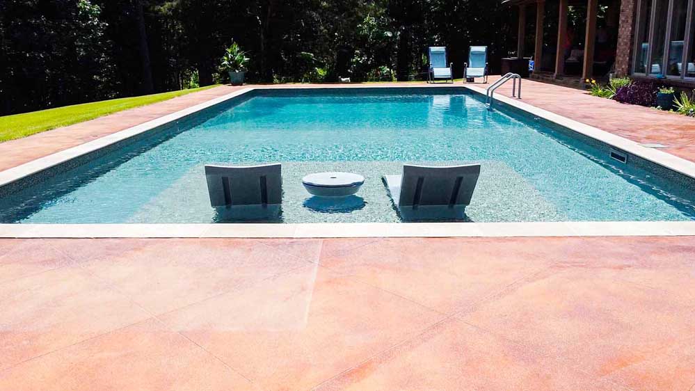 Pool designers in Tupelo, Mississippi created a stunning backyard oasis.